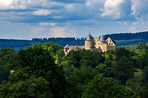 Hofgeismar, Hesse, Germany - July 12, 2021: The castle of the sleeping beauty Dornröschen Sababurg at Hofgeismar in Hesse