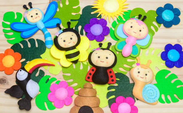 Colorful handmade felt toys collection for playful little kid. Concept of early childhood development. Colorful handmade felt toys collection for playful little kid. Concept of early childhood development. felt textile photos stock pictures, royalty-free photos & images