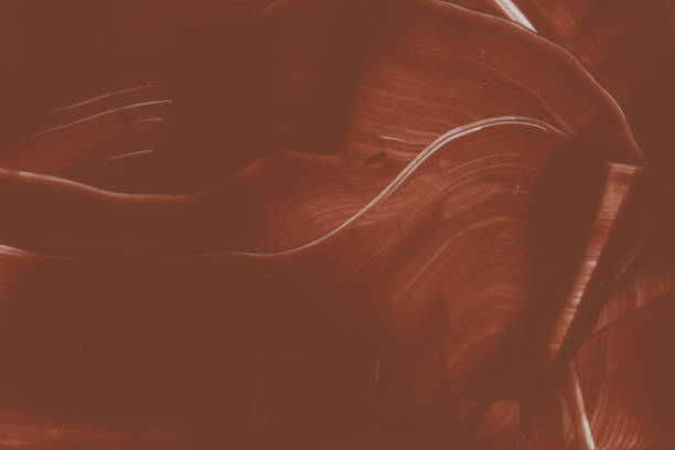 istock Abstract brown painted background with chocolate spiral texture and smooth cacao textured effect. 1334783360