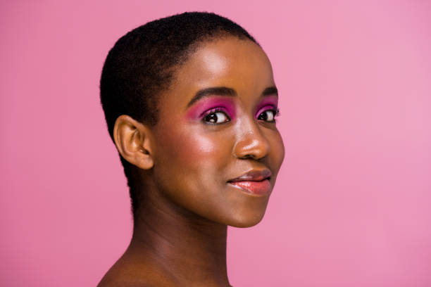 istock Three quarter portrait young African woman smiling into camera 1334785342