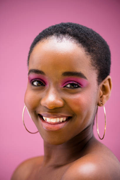 istock Happy young woman smiling and looking into camera 1334785370