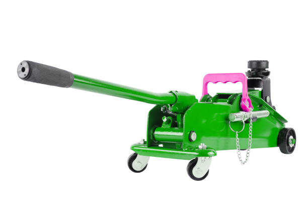istock green hydraulic car jack isolated on white background, lowered 1334786272