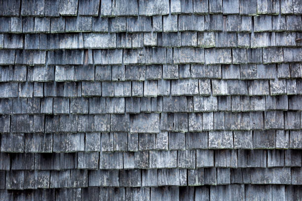 wood roof tiles on a roof stock photo