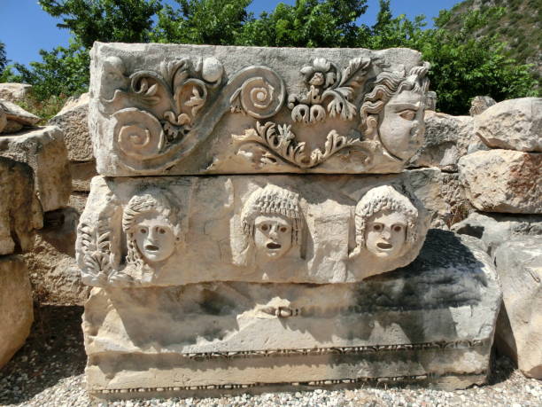 istock Masks and rock tombs in Myra, Turkey 1334791967