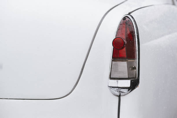 istock Rear headlight of a white retro car 1334794436