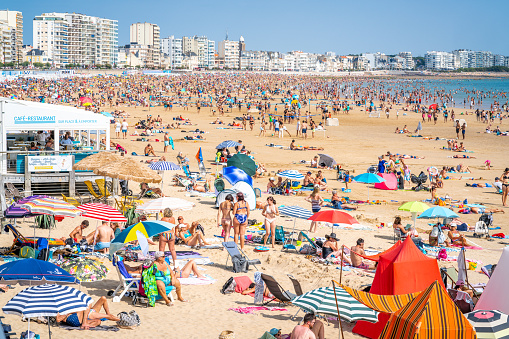 12 August 2021 , Les Sables d'Olonne France : View of La Grande Plage beach of Les Sables d'Olonne crowded with people during summer 2021 on France Atlantic coast
