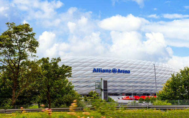 Viewing to the Allianz Arena Soccer stadium from a car over the Motorway (Autobahn) A9 Munich, Germany - August 21, 2021: Exterior view of Allianz Arena - Football Stadium - Munich Germany. allianz arena stock pictures, royalty-free photos & images