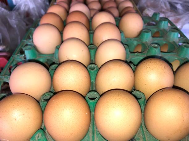 istock chiken eggs row in traditional market 1334796526