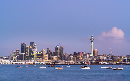 Auckland skyline in the evening across the water.