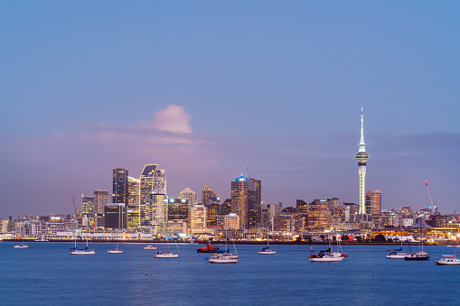 Auckland skyline in the evening across the water.
