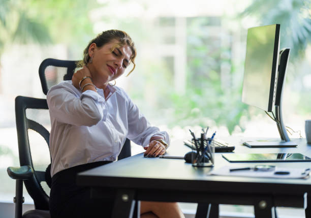 Businesswoman Having Neck Ache Due To Work Over Load And Bad Posture Businesswoman Having Neck Ache Due To Work Over Load And Bad Posture ergonomics photos stock pictures, royalty-free photos & images