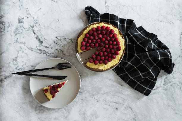 istock Delicious cheesecake with raspberries on plate, closeup 1334801919