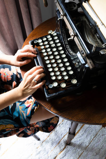 istock Woman typing on an old typewriter 1334802962