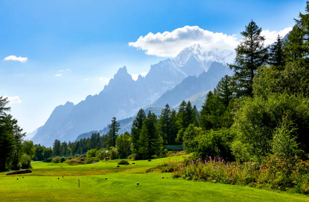 Golf course at the foot of the Mont Blanc Massif, in Val ferret Golf course at the foot of the Mont Blanc Massif, in Val ferret dent du geant stock pictures, royalty-free photos & images