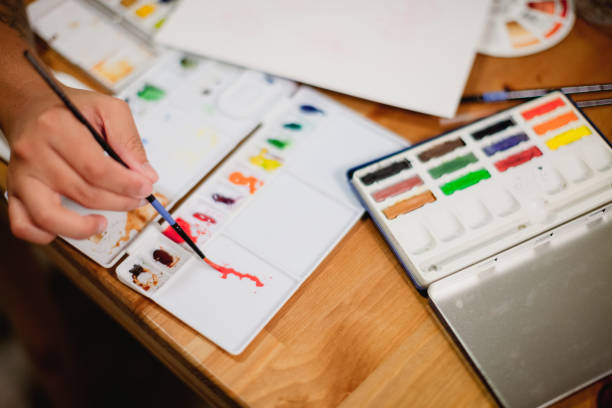 istock Hispanic Woman Painting and making art 1334805501