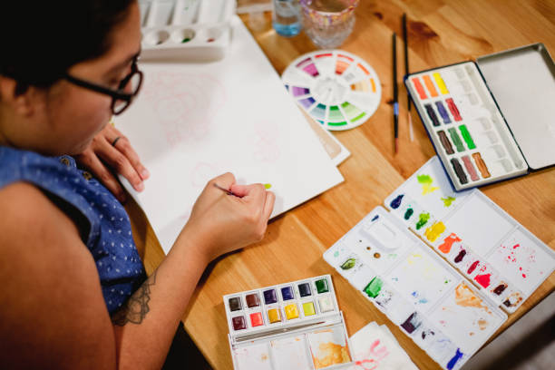istock Hispanic Woman Painting and making art 1334805609