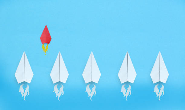 istock Small business concept with small red paper plane on blue background 1334806349