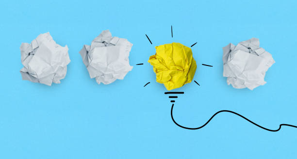 istock Creative idea, Inspiration, New idea and Innovation concept with Crumpled Paper light bulb on blue background 2 1334806451