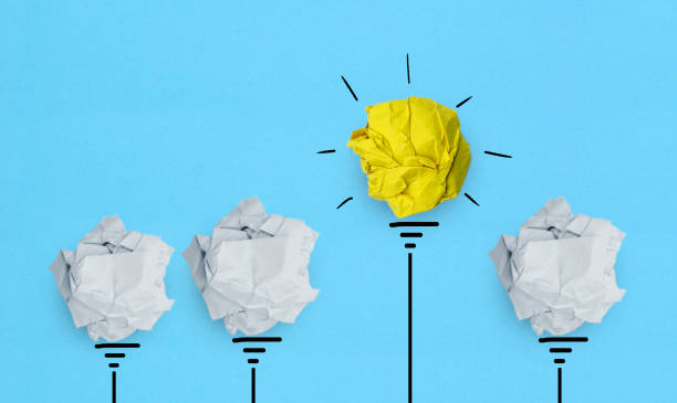 istock New idea, Creative idea, Inspiration and Innovation concepts with Paper light bulb 1334806637