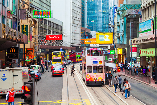 HONG KONG - MARCH 19, 2013: Double decker tramway or tram is a symbol of Hong Kong city in China