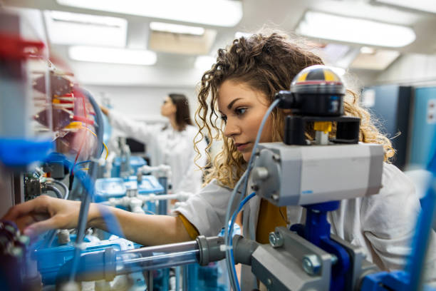 istock Beautiful female engineer working in lab 1334807993