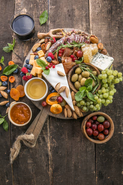 istock Antipasto background. Different Italian snacks with fruit, nut on a rustic background. 1334808909