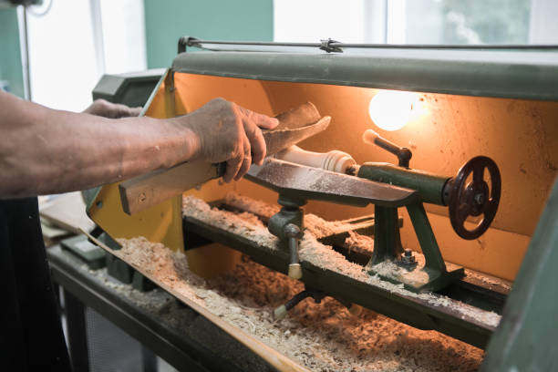 istock Turning a wooden part on a lathe. Joinery. Carpentry work. Mechanical woodworking 1334809652