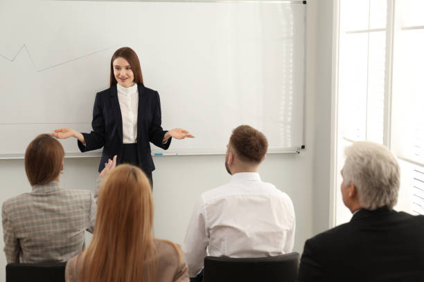 istock Professional business trainer working with people in office 1334811092