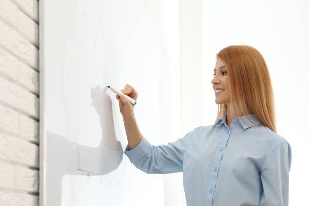 istock Professional business trainer near whiteboard in office 1334811149
