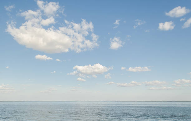Big lake with clouds in sunny summer day, Lithuania.