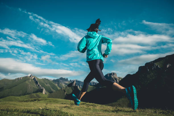 istock Young woman trail  runner running at mountain top 1334812624