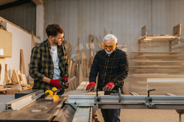 istock Father and son-carpenters in a workshop 1334813950