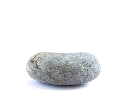 Stone podium or platform for cosmetic products or other object. Pebble isolated on white background