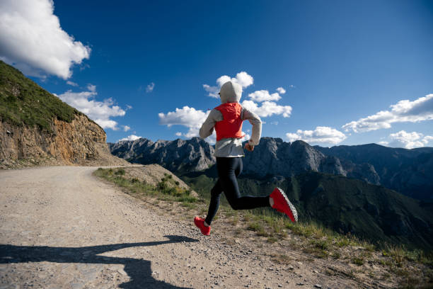 istock Woman ultramarathon runner running at mountain top 1334814289