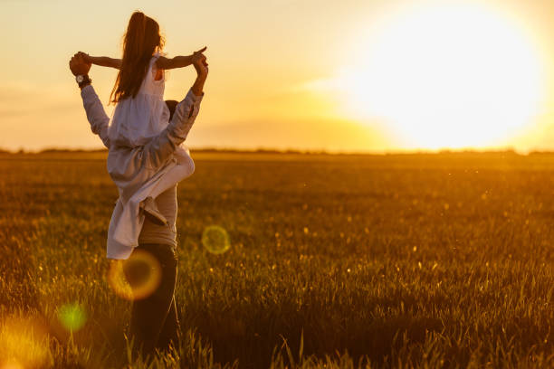 istock Father and daughter enjoying day in nature 1334814755
