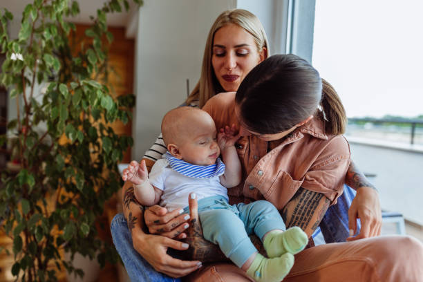 istock Same sex parents with their kid 1334816395