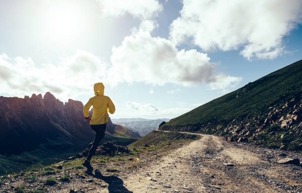istock Woman ultramarathon runner running at mountain top 1334816676