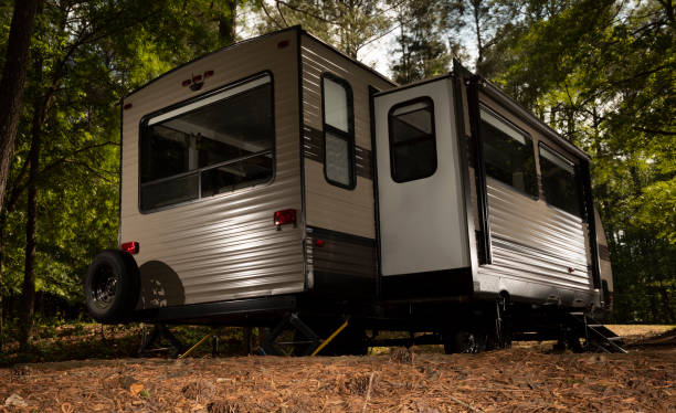 istock Slide out extended on a camper trailer at a campsite 1334817996