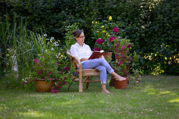 Woman enjoy relaxing in the garden stock photo