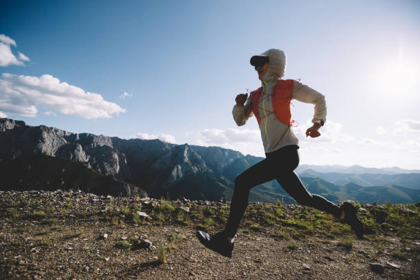 istock Young woman ultramarathon runner running at mountain top 1334818079
