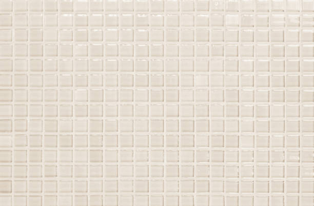 istock Cream pastel ceramic wall and floor tiles abstract background. Design geometric mosaic texture decoration of the bedroom. Simple seamless pattern for backdrop advertising banner poster or web. 1334819183