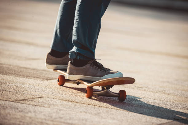 istock Skateboarder riding on skateboard outdoors in city 1334822329