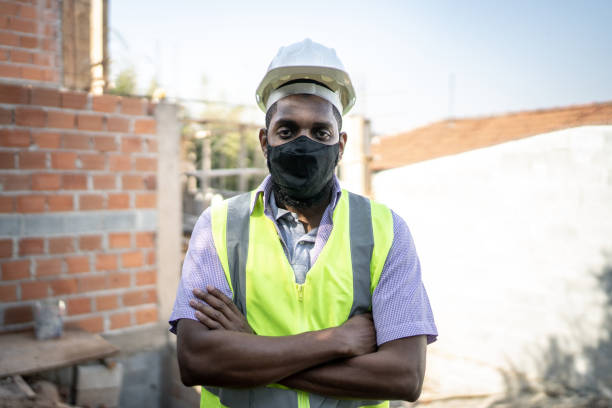 istock Portrait of a construction worker using protective face mask in construction site 1334823061