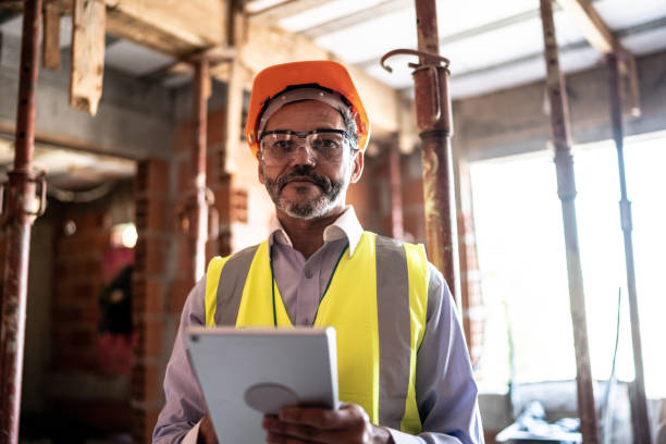 istock Portrait of an engineer working with a digital tablet at a construction site 1334823442