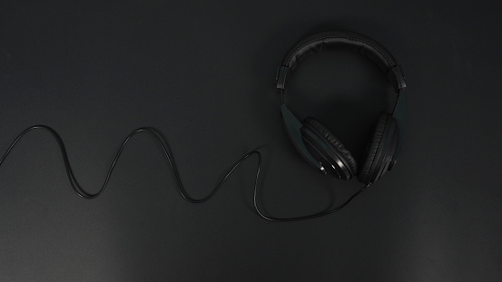 Headphones isolated on black background.