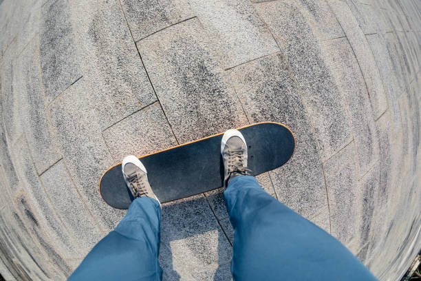 istock Skateboarder riding on skateboard outdoors in city 1334825049