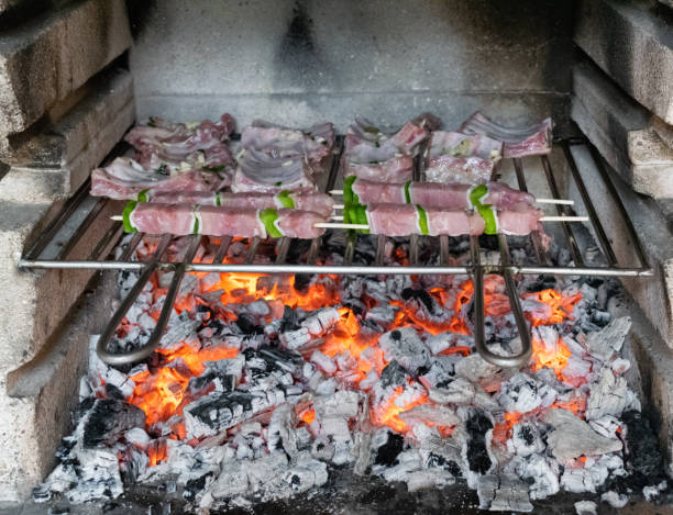 istock Meat and skewers grilling on the barbecue 1334825430