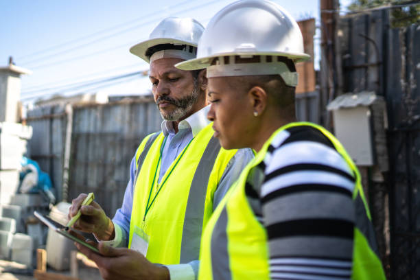 istock Engineer and contractor doing an informal meeting on construction site 1334826073