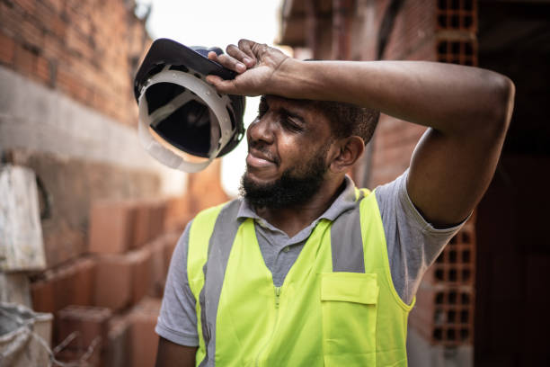 exhausted construction worker at construction site - compressed imagens e fotografias de stock