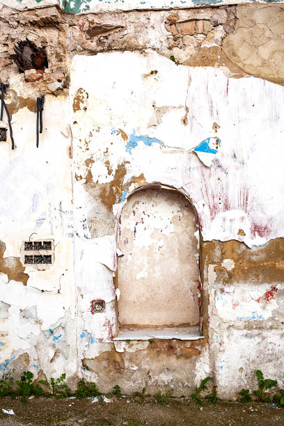 istock building wall destroyed by time and abandoned on a ground 1334830876